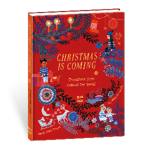 A Red cover with children from around the world in holiday sweaters in the lights