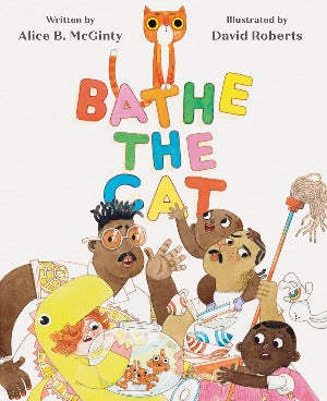 a family of two dads, one with darker skin and black hair and 3 children are holding the dishes, goldfish and a mop while the orange cat sits on top of the letters spelling the title.