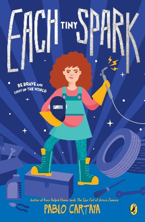a young redheaded girl with a green pinafore, is holding a welders face sheild and the welding iron.