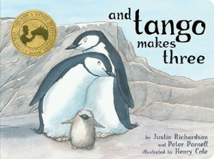 2 adult penguins with a baby penguin chick in front