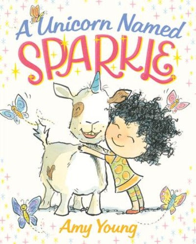 Book cover of a "unicorn" with a blue horn being hugged by a girl with black curly hair