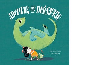 A young girl holding up her dinosaur
