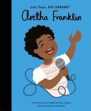 a picture of a young Aretha Franklin wearing a smocked dress holding a microphone