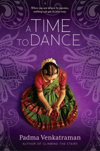 Book cover of seated Indian dancer in red and green traditional outfit