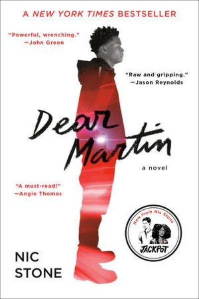 Book cover with African-American boy standing  in profile with  lights reflected red
