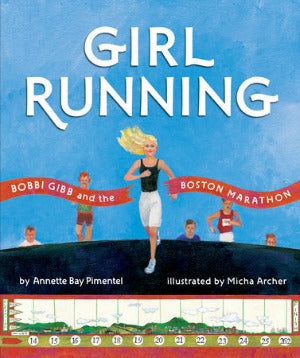a young woman with blond hair running towards a finish tape in a race
