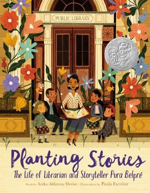 a group of people on library steps looking at  Pura Belpre