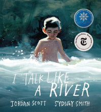 a young boy is waist high in the river rapids which are swirling around him