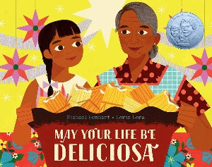 a young girl with her grandmother are standing in behind of a big dish full of tamales