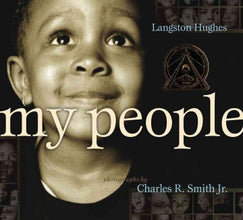 Book Cover; a photograph of a young black boy looking up and smiling