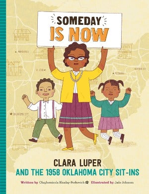 an African American teacher holding a sign with the title and two students