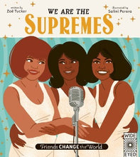 3 women of color smiling and singing by a vintage microphone