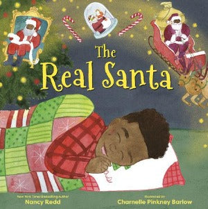 a black boy lying under a read and green christmas quilt