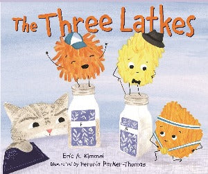 Three different colored latkes stand on a table while a gray cat peers over the table up at them. Two of the latkes are standing on a set of salt and pepper shakers. One of them is wearing a gold medal.