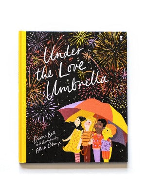 4 children under a brightly colored umbrella watching fireworks in the dark night sky